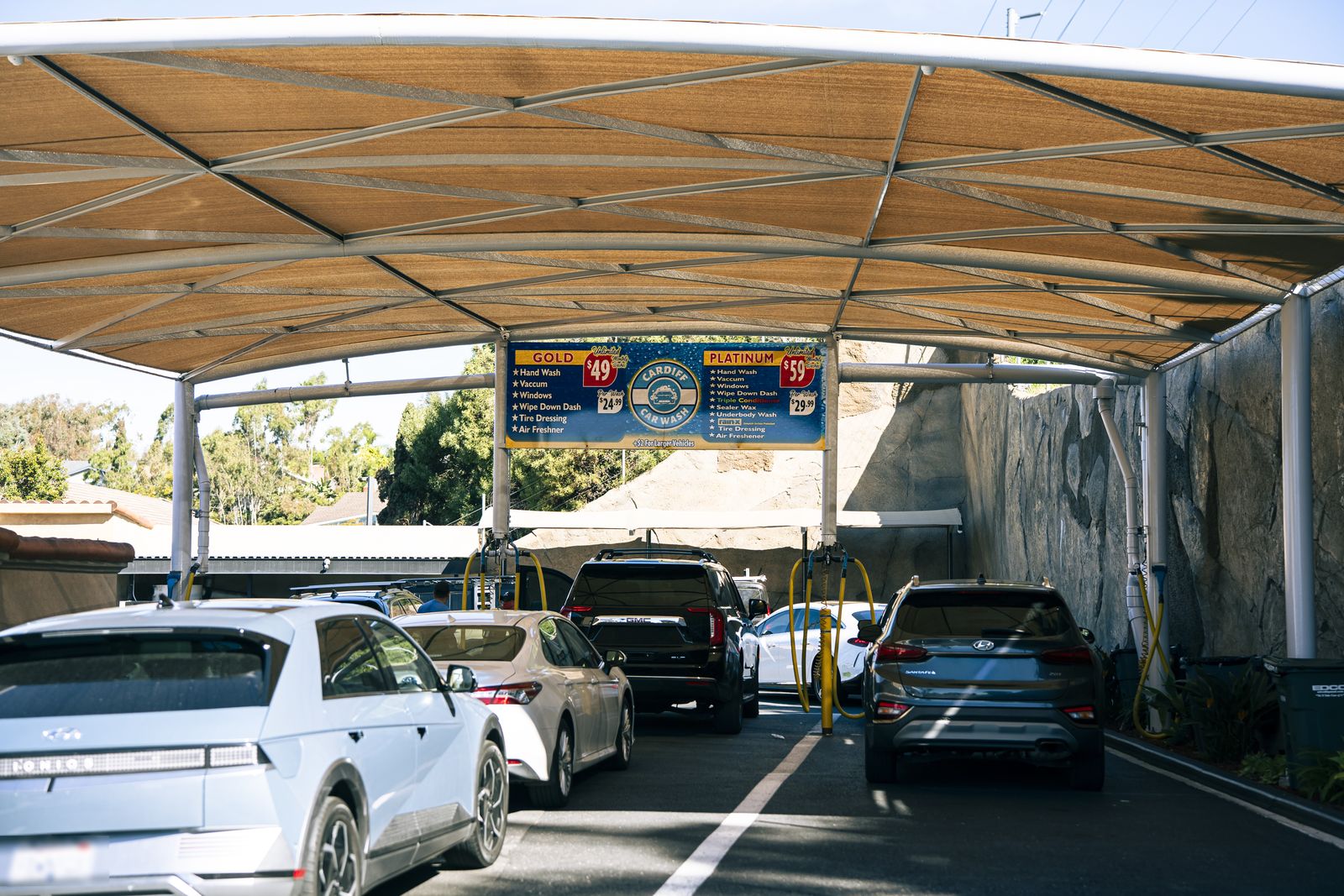 Cars including a Rivian under the Cardiff shade canopy